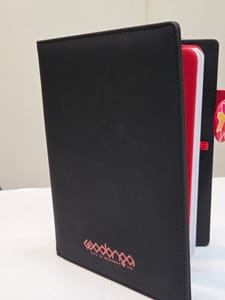 black notebook with logo printed