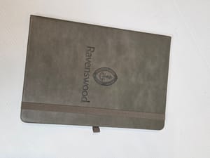 leather notebook with deboss-branded pattern