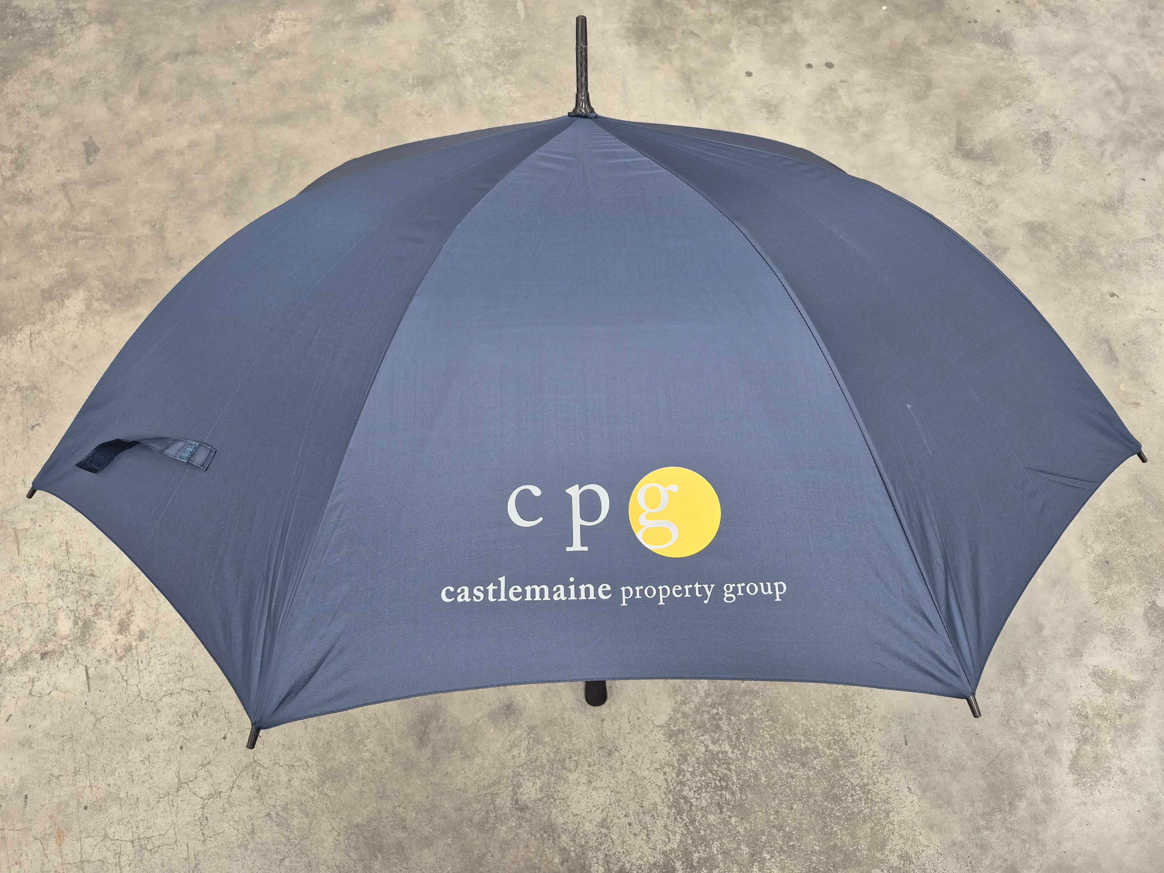 Custom printed umbrella with a property group logo