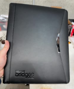 compendium with logo debossed